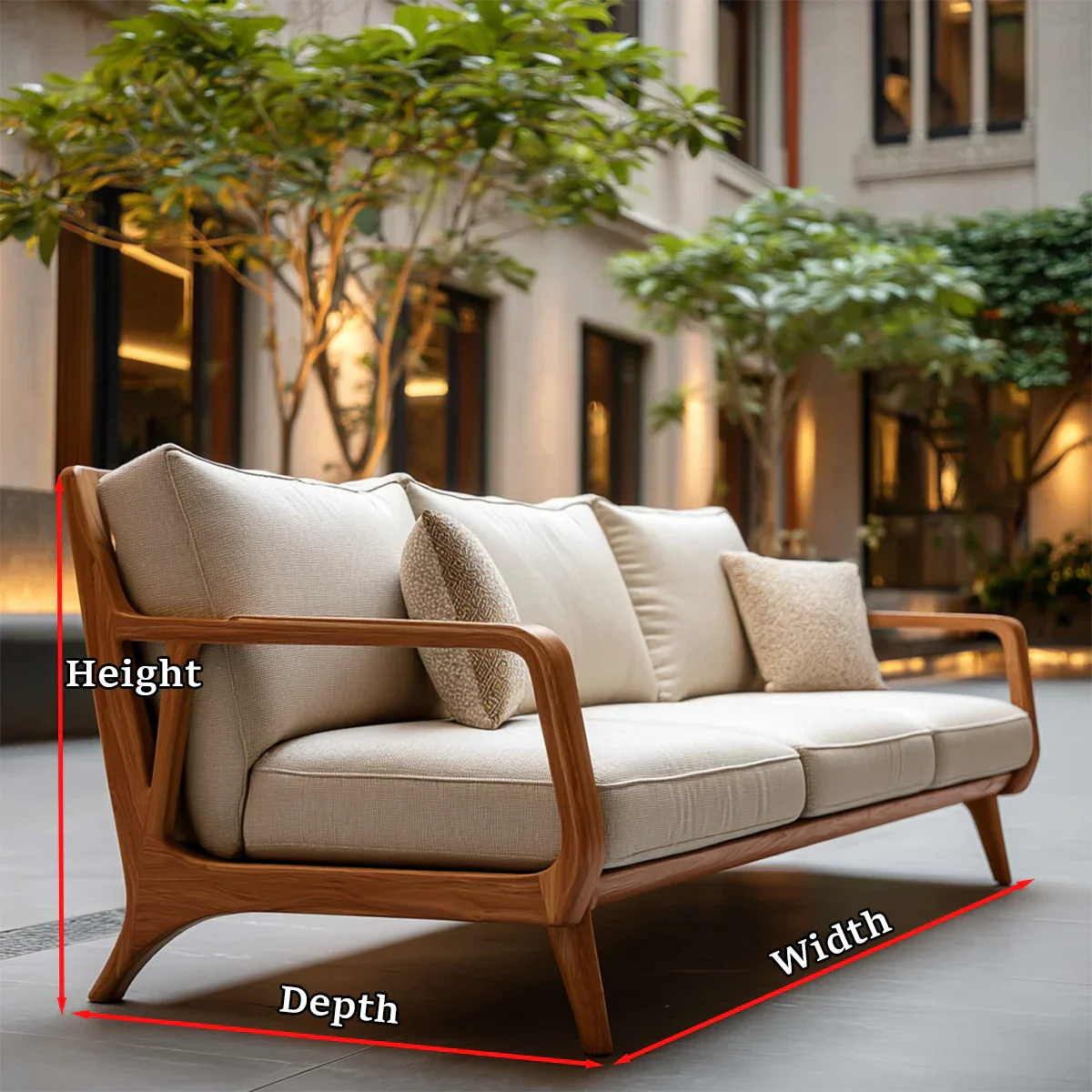 Premium upholstered sofa with sculpted wood frame and plush cushions in relaxed outdoor environment