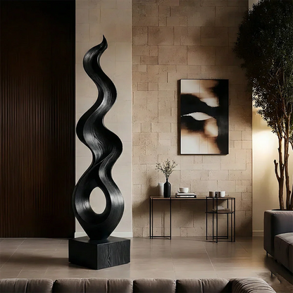 Organic modern sculpture displaying elegant twisting lines and warm black tone finish style