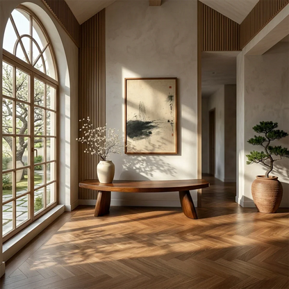 Modern hallway bench showcasing gently curved slab form and refined walnut tone finish detail