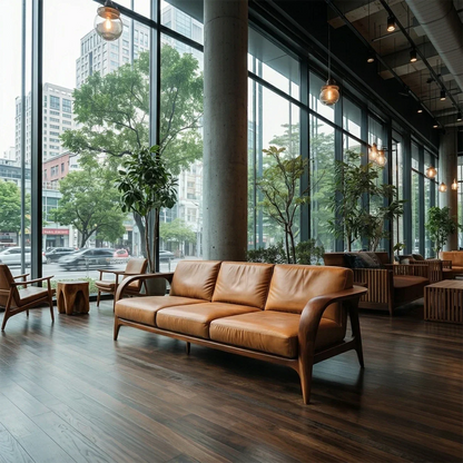 Contemporary leather sofa featuring sculpted wood arms and clean lines beside large glass windows