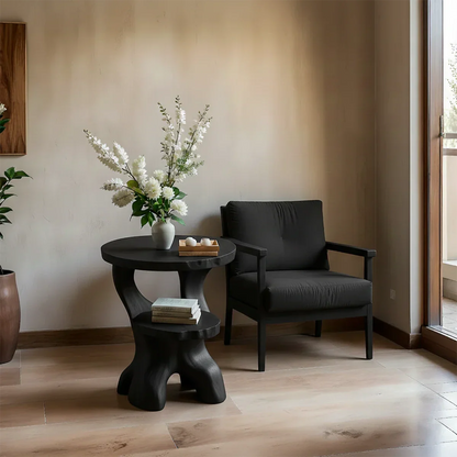 With its black color finish, the accent table blends organic curves and modern styling