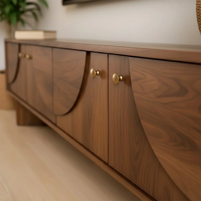 Modern TV stand in soft brown finish with smooth surface and low profile in a bright interior