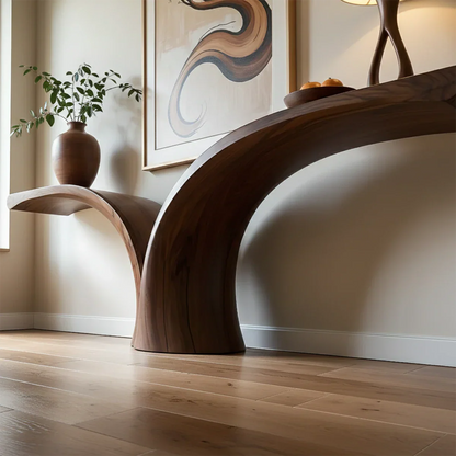 In this stylish interior, a curved wood console table creates a bold sculptural focal point