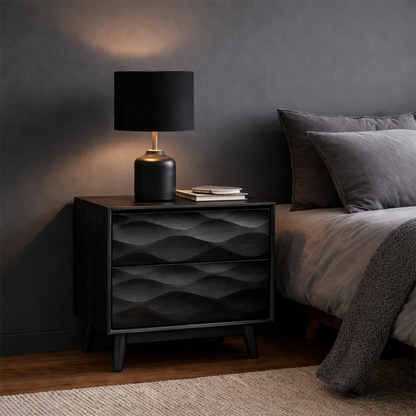 Functional bedside cabinet designed with modern carved styling and smooth black tone finish