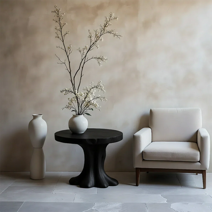 Minimal black tone accent table with curved base and clean design for modern interiors