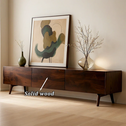 TV stand in walnut finish with clean lines and organic grain detail in a modern home interior