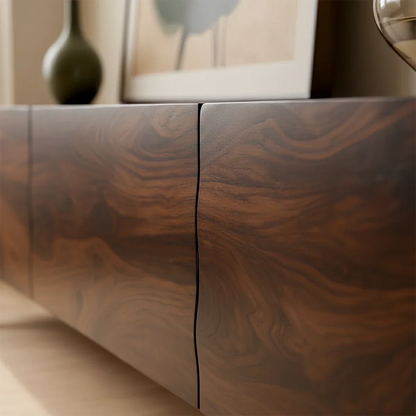 Walnut finish TV stand with smooth surface and natural grain detail in a minimalist living space