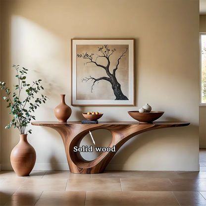 Refined entryway featuring a sculptural wood console table with seamless curved base structure