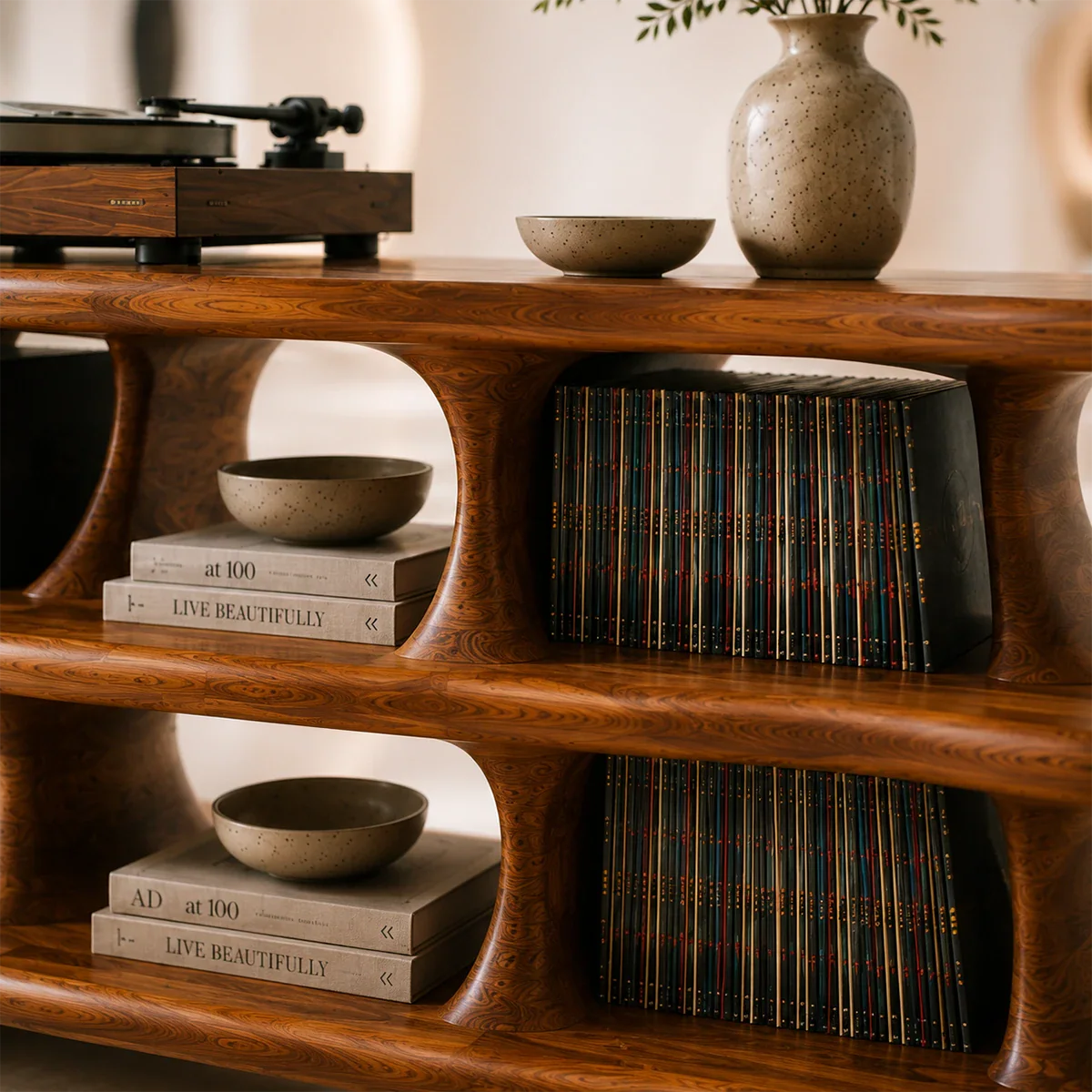 Sculptural record player cabinet designed with integrated vinyl storage compartments