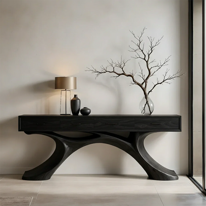 Refined entryway console featuring sculptural base and clean drawer storage layout