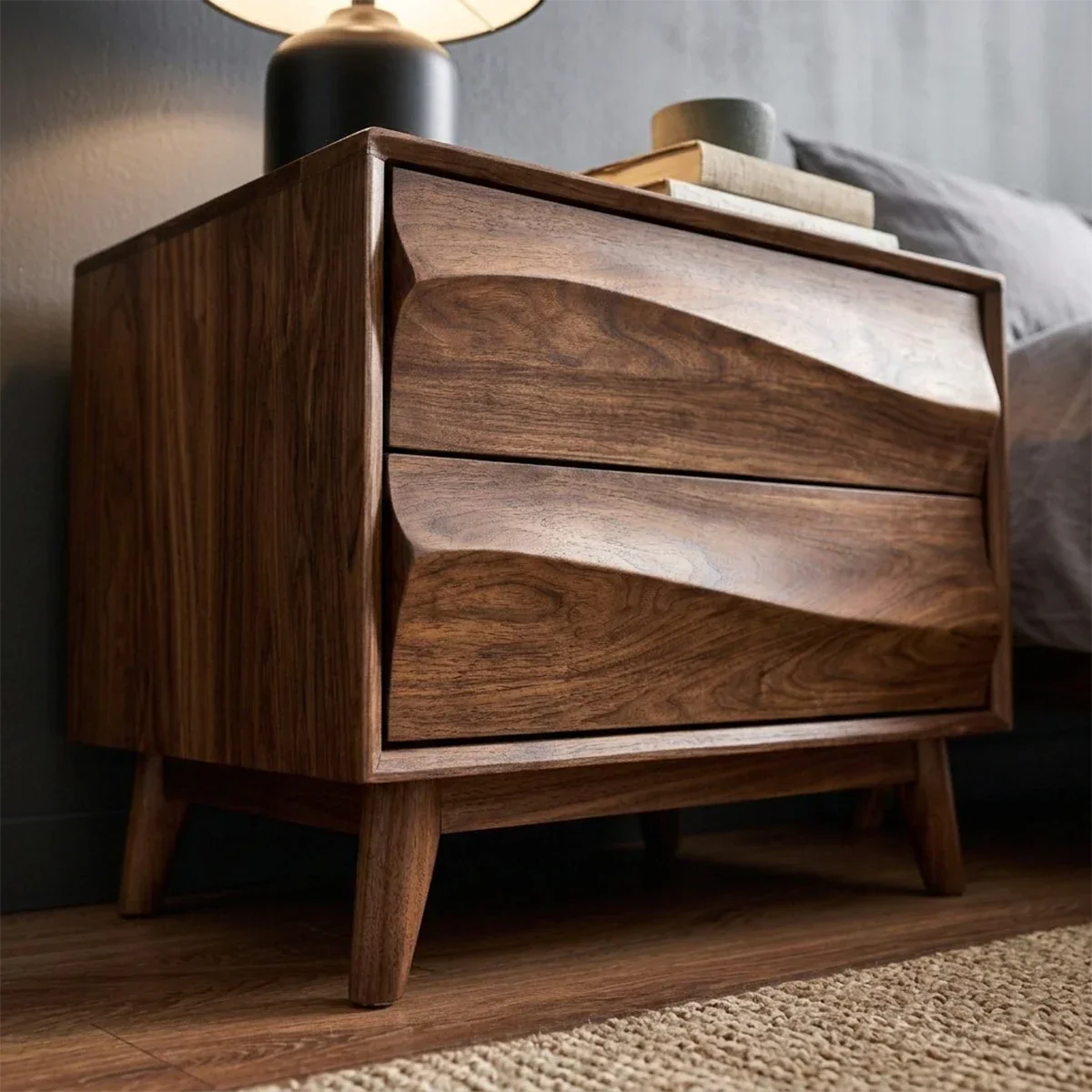 Decorative modern nightstand featuring sculptural drawer fronts and rich walnut tone finish detail